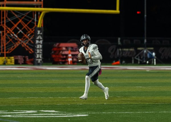 Friday night lights shining bright on quarterback Weston Goodman leading the Dubs with focus and confidence.