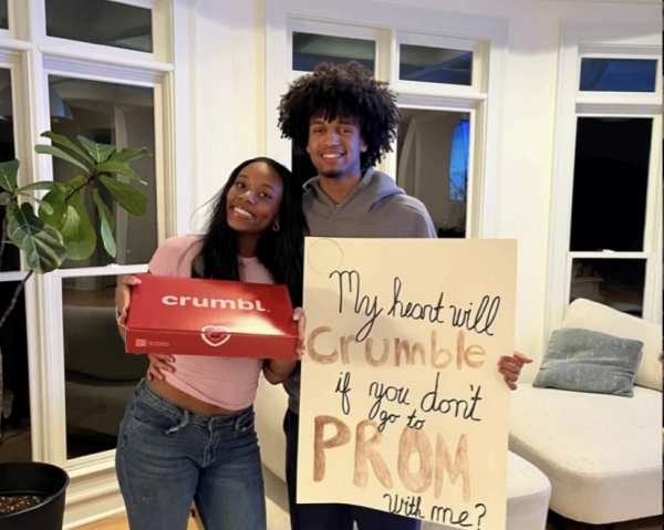 Promposal Done Sweetly: Junior Nehemiah Michael asks senior Blake Skurlock to prom with Crumbl Cookies. 